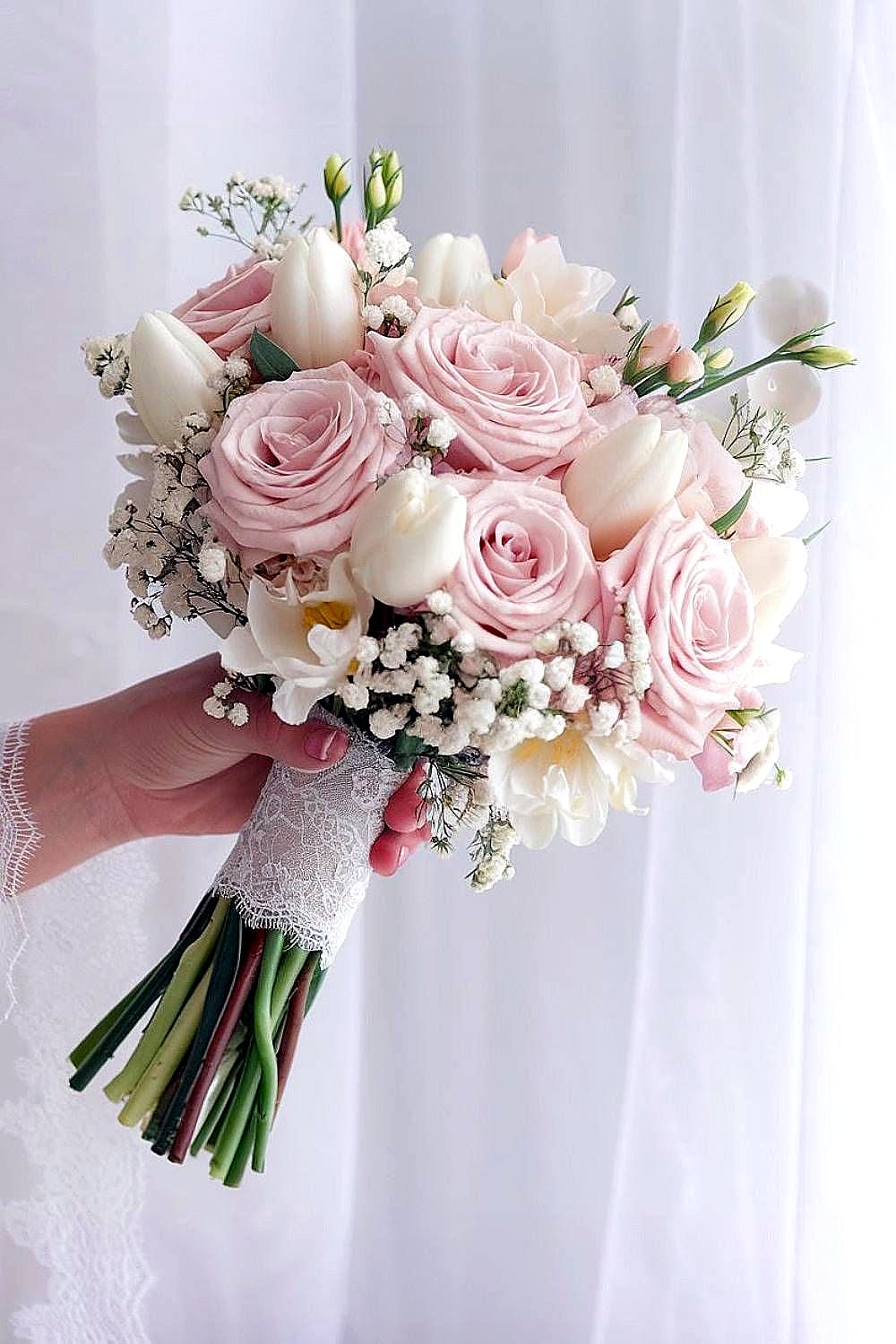 Hand-tied blush rose and white bridal bouquet